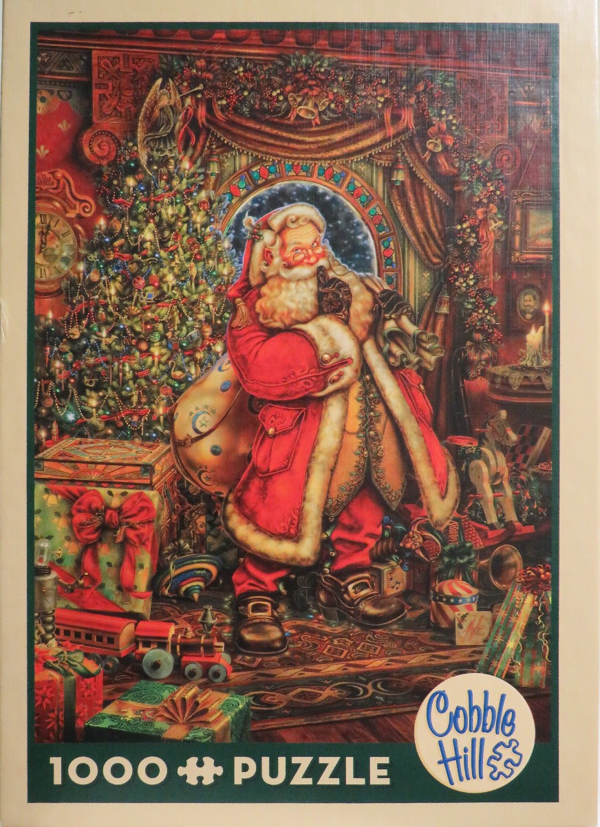 Santa Claus holding a finger to his lips in a festive, toy-filled room at night.