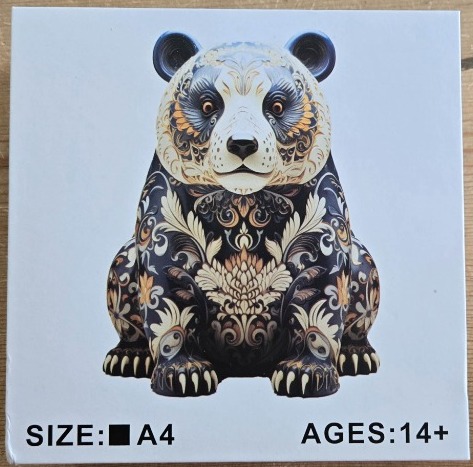 A digital illustration of a panda sitting in a frontal pose, covered in intricate, ornamental gold and cream filigree.