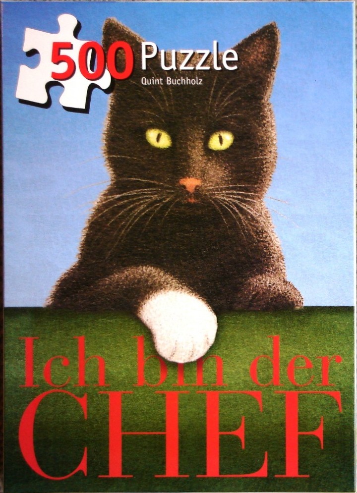 A black cat with a white paw staring forward against a blue background with red text at the bottom.