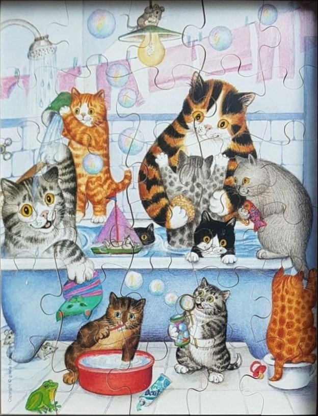 An illustration of several kittens interacting in a bathroom and a claw-foot bathtub.