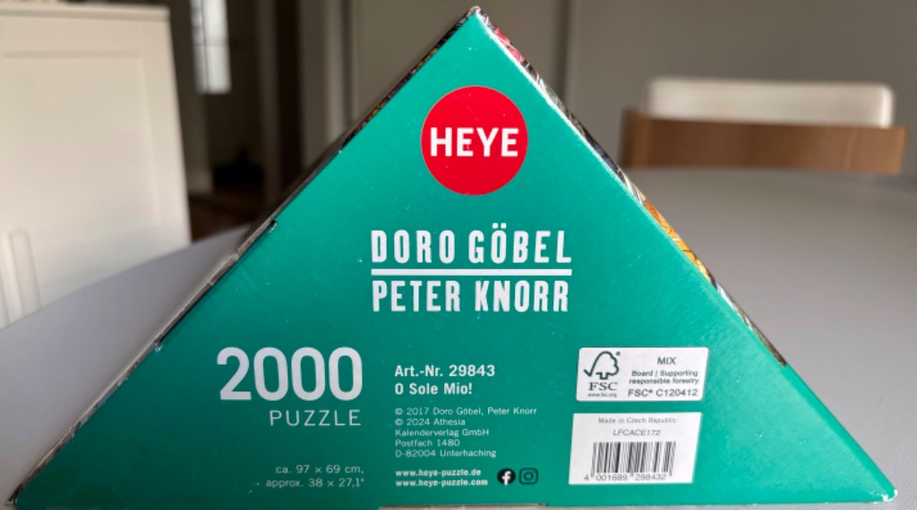Green box with text "2000 PUZZLE" and artists Doro Göbel, Peter Knorr.