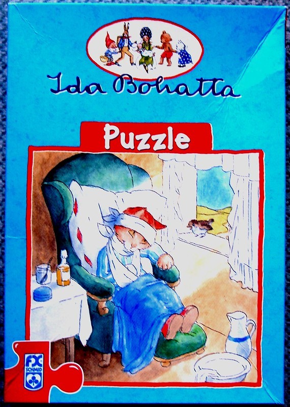 An illustration of an injured cat resting in a chair, by Ida Bohatta.