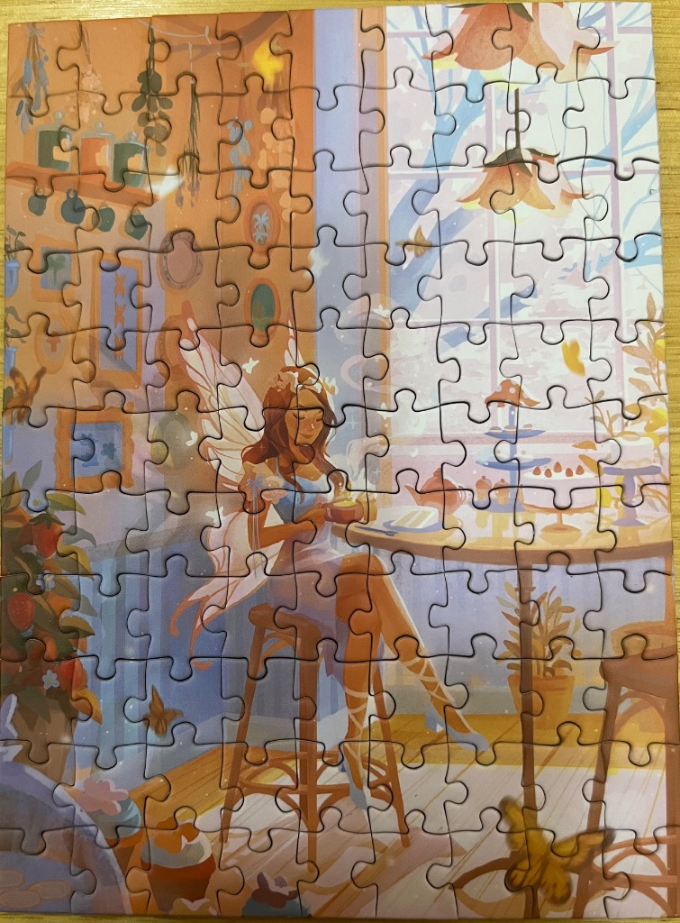 An illustration of a fairy sitting at a cafe table with tea and cake near a window.