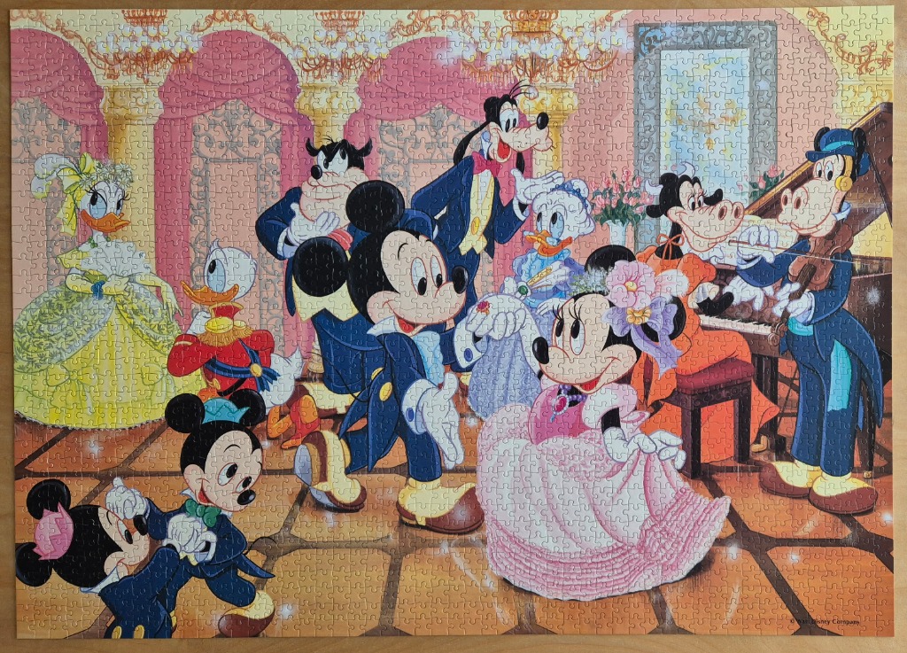 Mickey and Minnie Mouse and friends in formal Victorian attire attending a ballroom party.