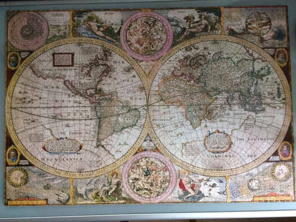 A vintage, double-hemisphere antique world map illustration featuring decorative cartography and mythological figures.