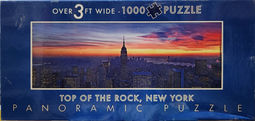 Panoramic sunset photograph of the New York City skyline viewed from the Top of the Rock observation deck.