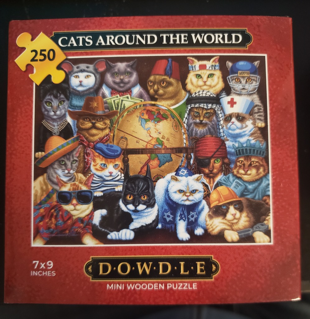 A whimsical illustration of many cats wearing various international costumes and cultural hats surrounding a central globe.