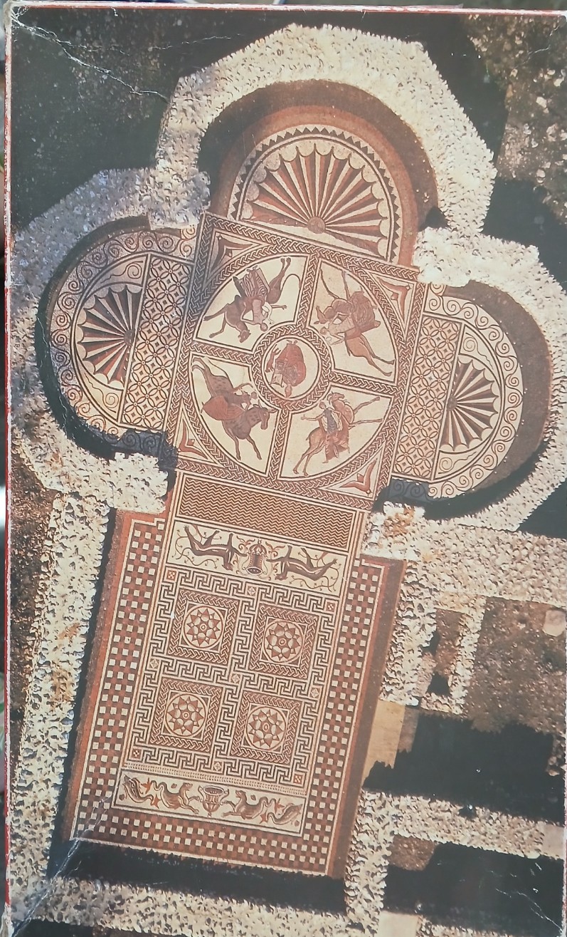 An overhead view of an ancient Roman-style floor mosaic featuring equestrian figures and geometric patterns.