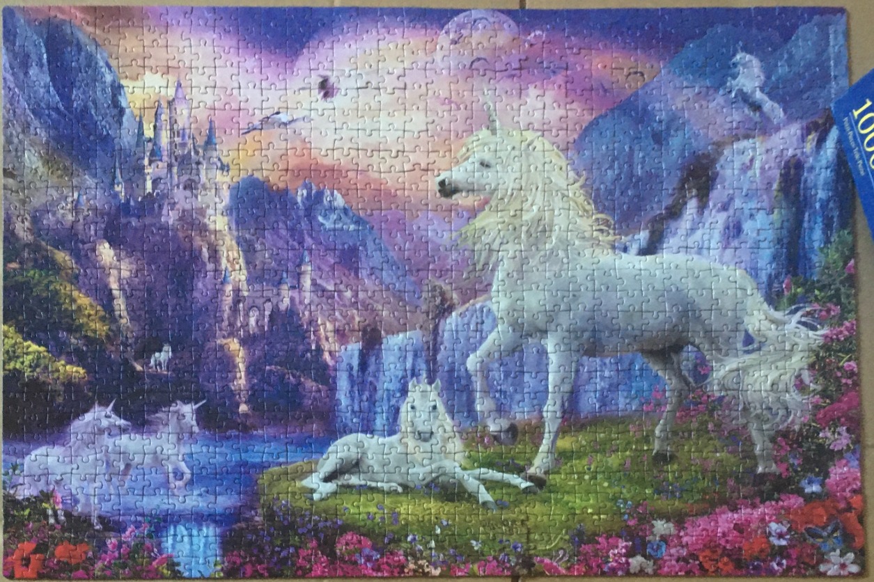 Fantasy illustration of white unicorns in a magical mountain landscape with a castle and waterfall.