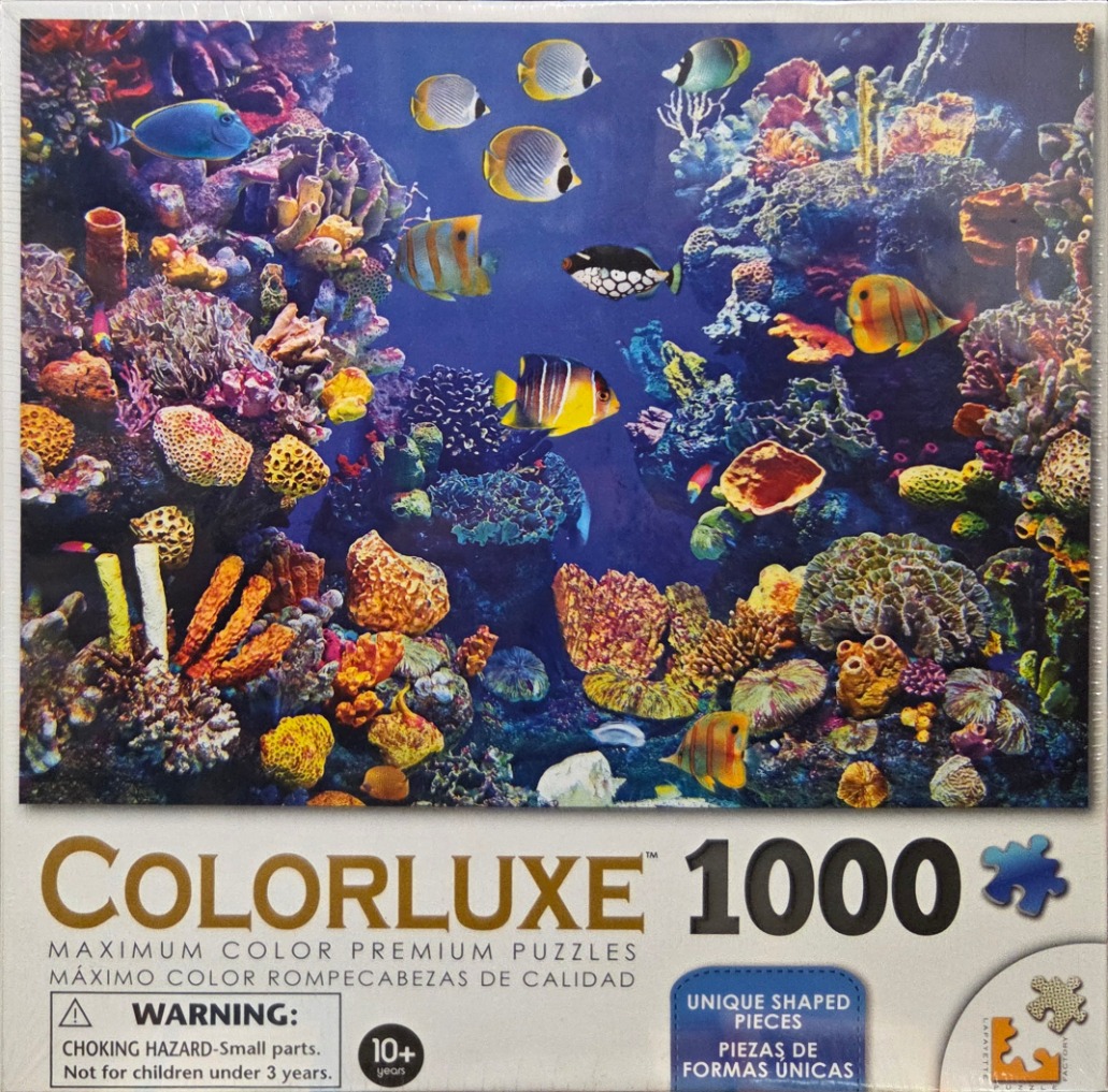 Underwater scene with a vibrant coral reef and many colorful tropical fish.