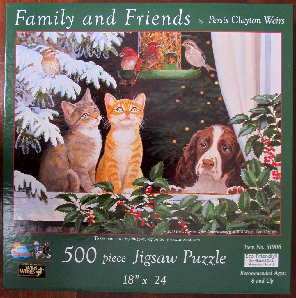 Painting of two kittens and a spaniel watching birds at a feeder outside a snowy window.