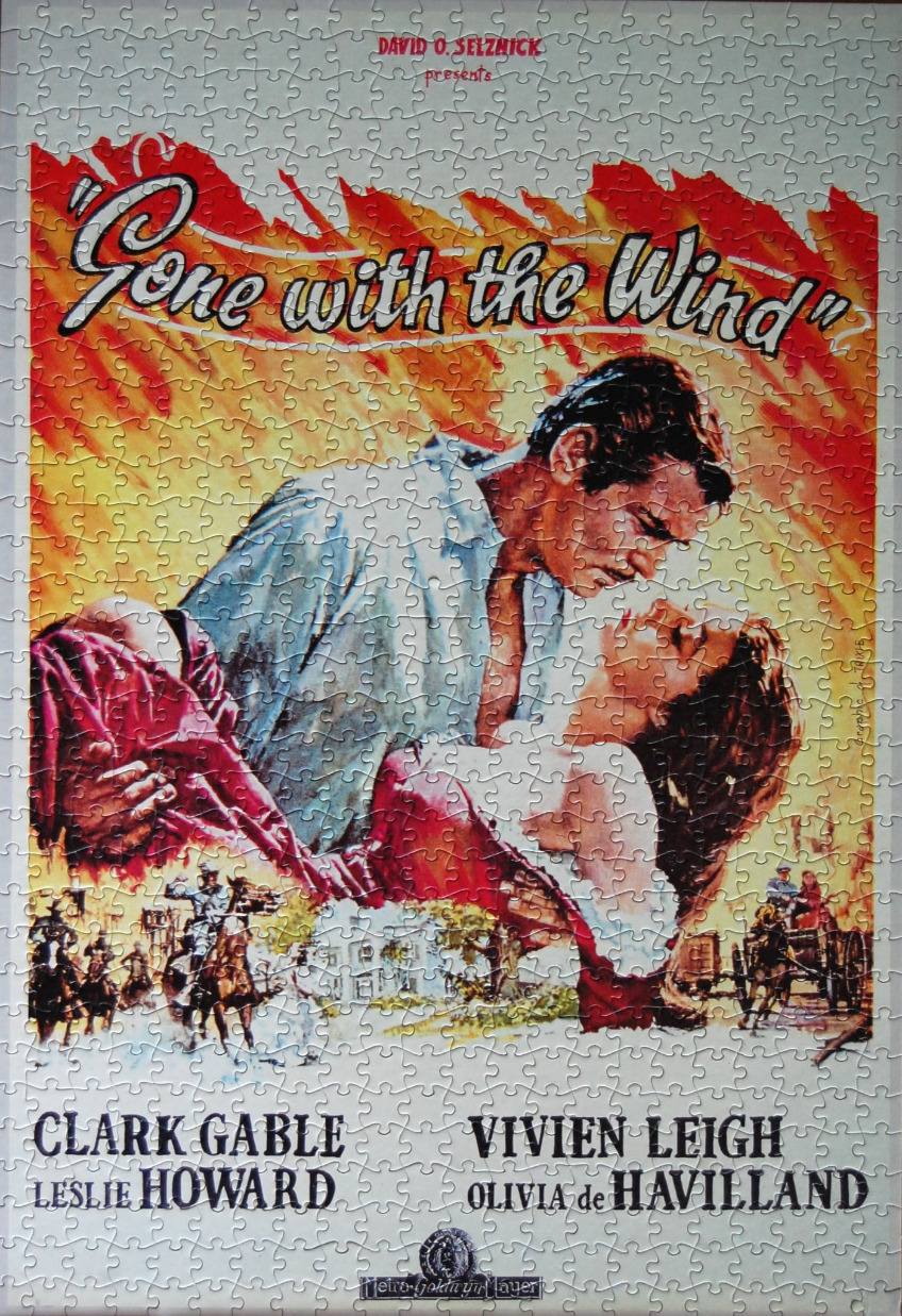 A vintage movie poster for Gone with the Wind showing Clark Gable and Vivien Leigh in a romantic embrace.