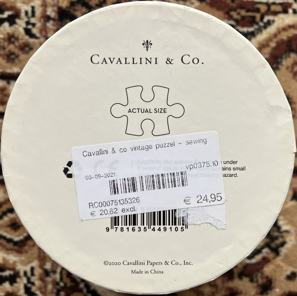 Vintage sewing themed round box, with label showing price and product code.