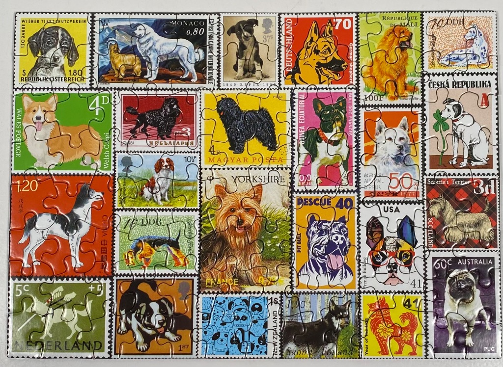 A collage of international postage stamps featuring various dog breeds.