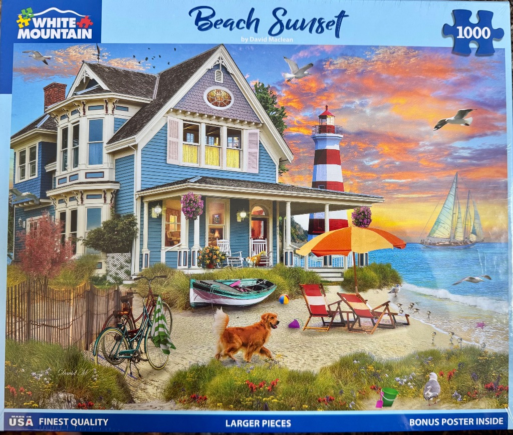 A blue Victorian house on a beach at sunset with a lighthouse, sailboat, and golden retriever.