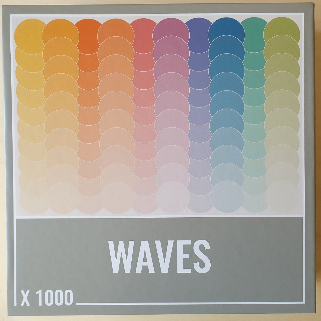 A gradient pattern of vertically aligned circles in a spectrum of colors ranging from yellow to green.