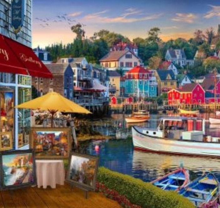 A charming seaside village with colorful buildings and boats anchored in a calm harbor at sunset.