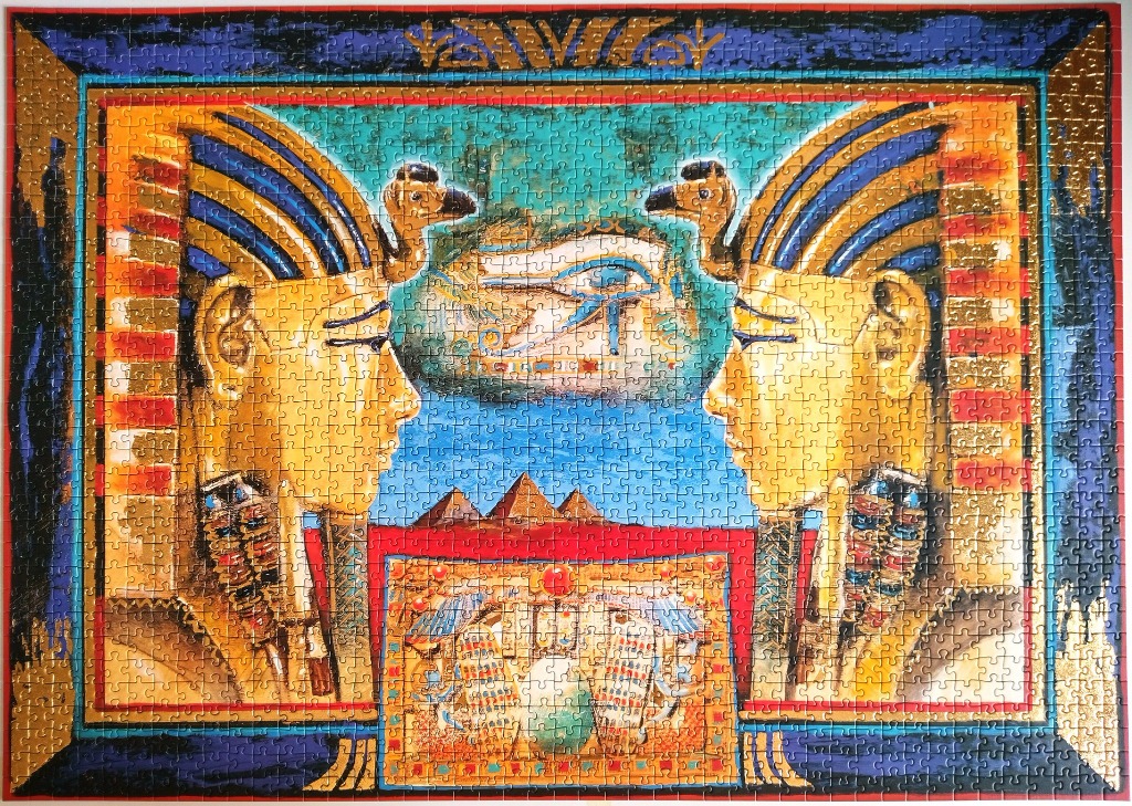 Artistic Egyptian-themed illustration featuring two mirrored pharaoh heads and the Eye of Horus.