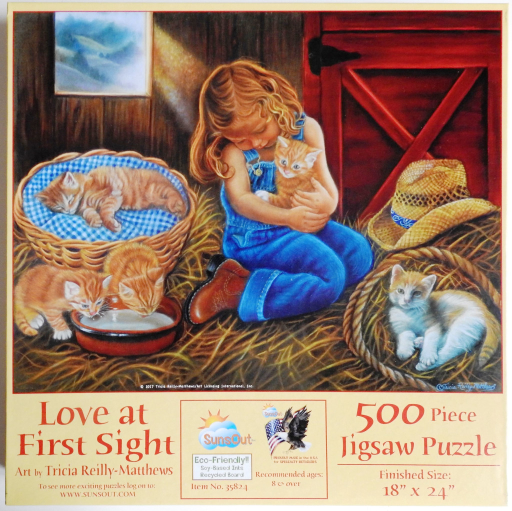 A young girl in denim overalls sitting in a barn filled with hay, surrounded by several orange tabby kittens.