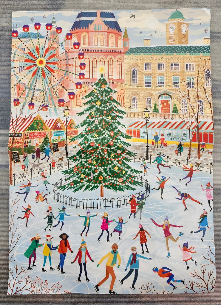 A lively outdoor ice skating rink set in a festive European town square featuring a large decorated Christmas tree.