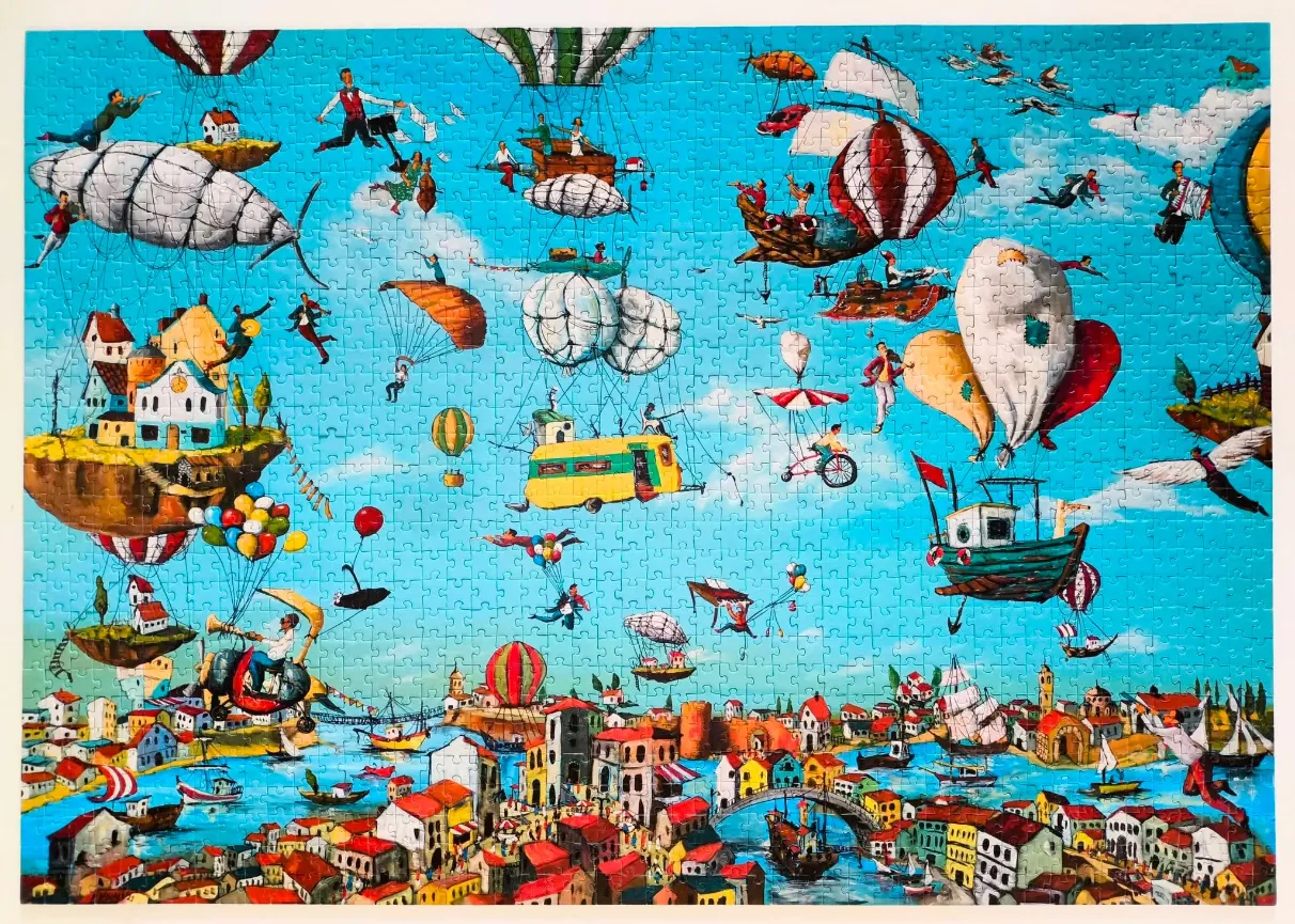 Whimsical fantasy scene featuring a bustling sky filled with flying houses, boats, and balloons over a coastal town.
