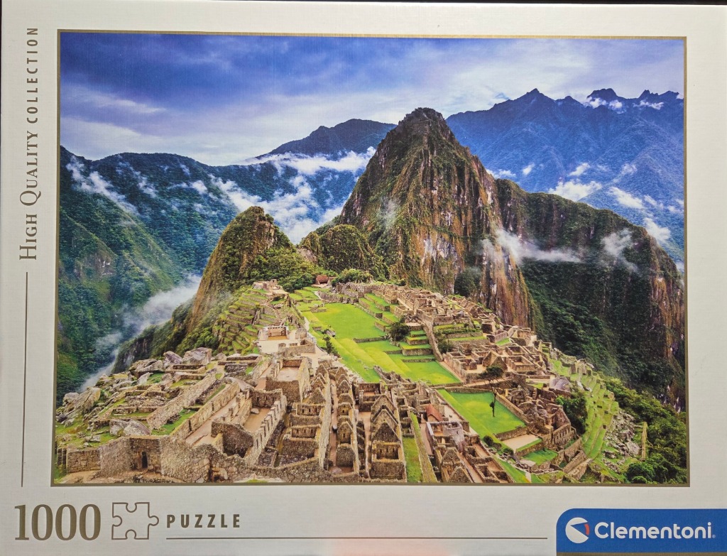 A scenic, high-angle photograph of the ancient Inca citadel of Machu Picchu nestled in the Andes Mountains.