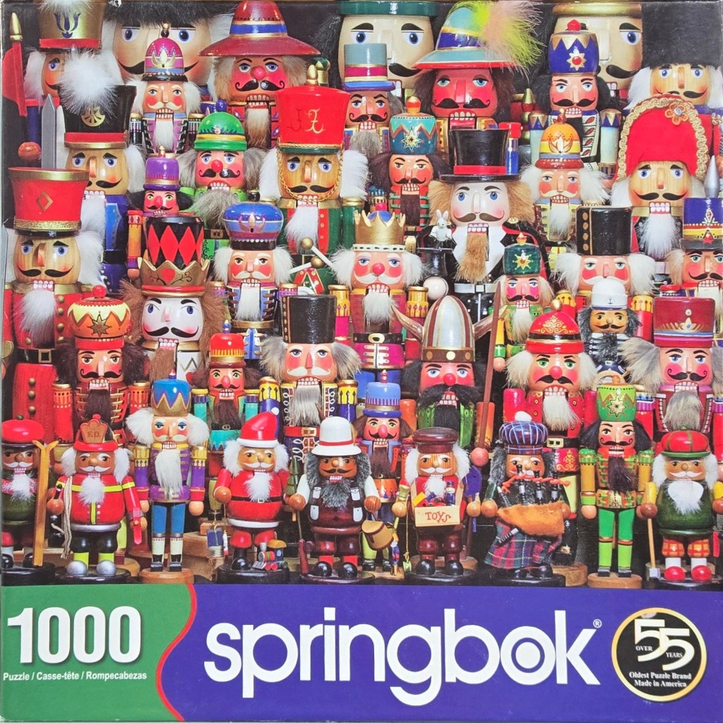 A dense crowd of colorful wooden nutcracker dolls arranged closely together.