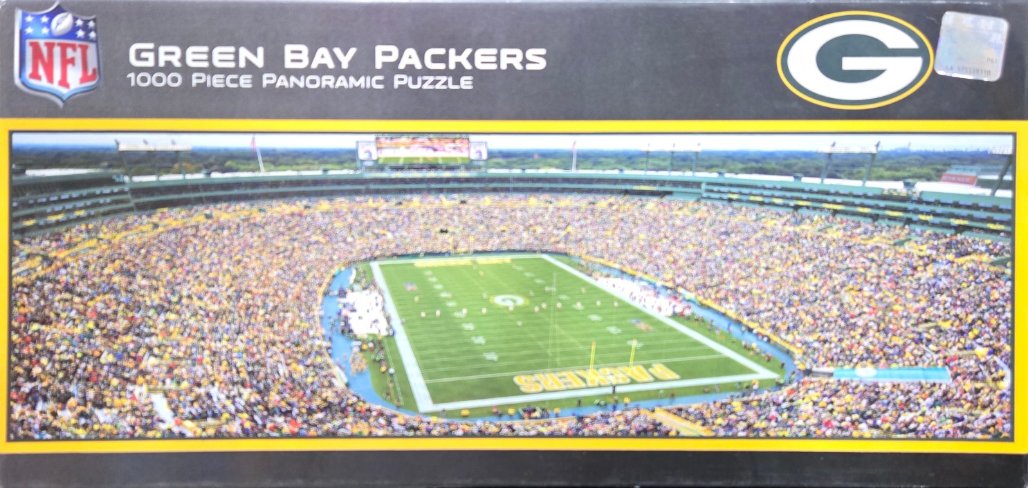 A panoramic aerial photograph of Lambeau Field in Green Bay filled with fans during an American football game.