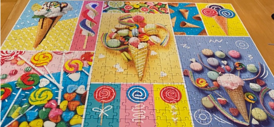 A collage of various colorful ice cream cones, lollipops, and sweets.