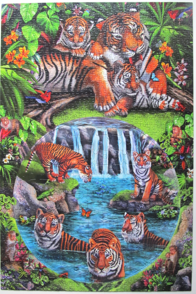 A lush jungle scene with a family of tigers above and a circular portal showing tigers by a waterfall below.