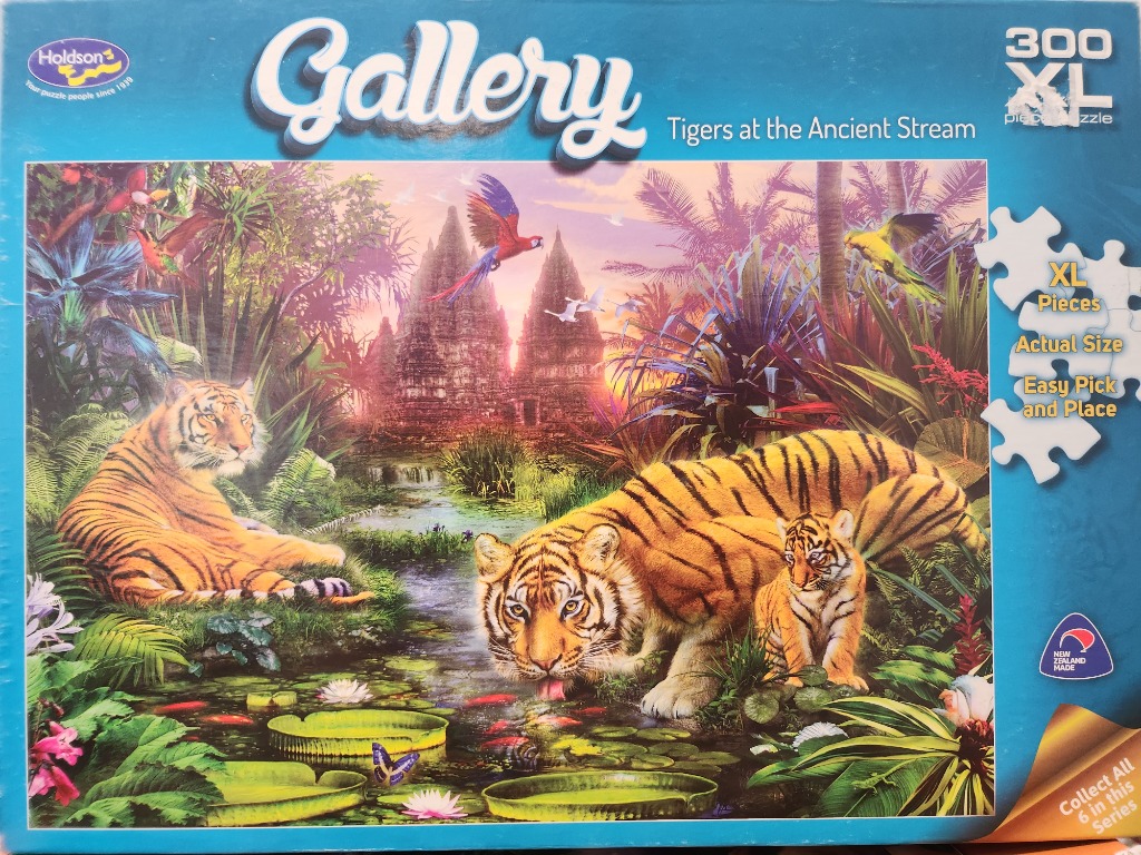 A tiger mother and cub resting by a stream in a lush jungle with ancient stone temples in the background.