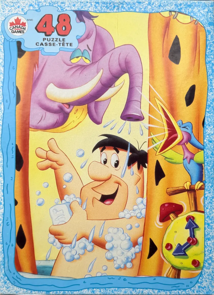 Fred Flintstone taking a bubble bath with a purple elephant shower head and a bird alarm clock.