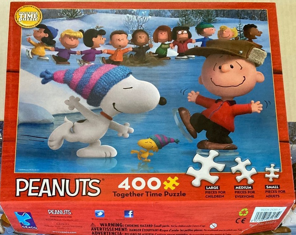 Snoopy, Charlie Brown, and friends ice skating in a snowy landscape.