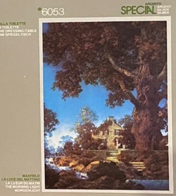 A peaceful scene featuring an old stone house framed by a large tree near a running stream in morning light.