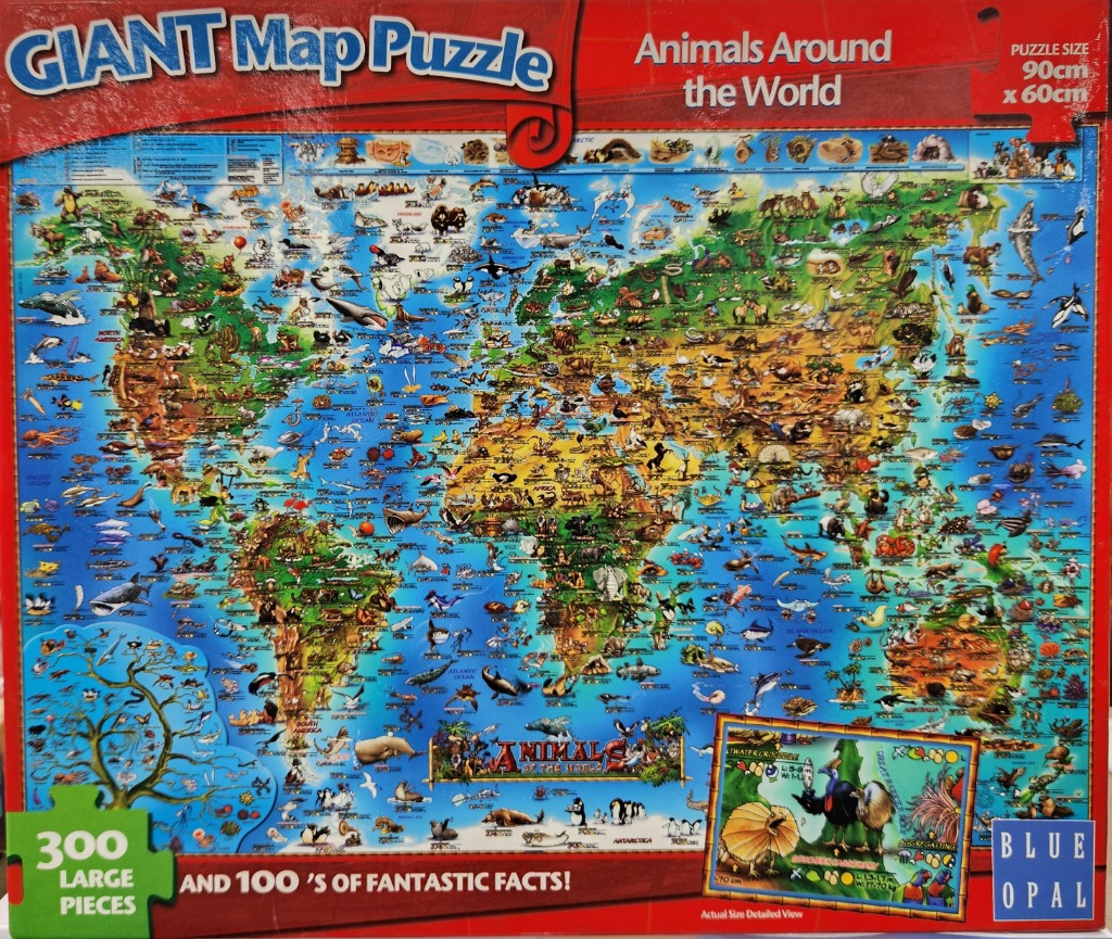 A colorful world map illustration densely populated with diverse animal species native to each continent and ocean.