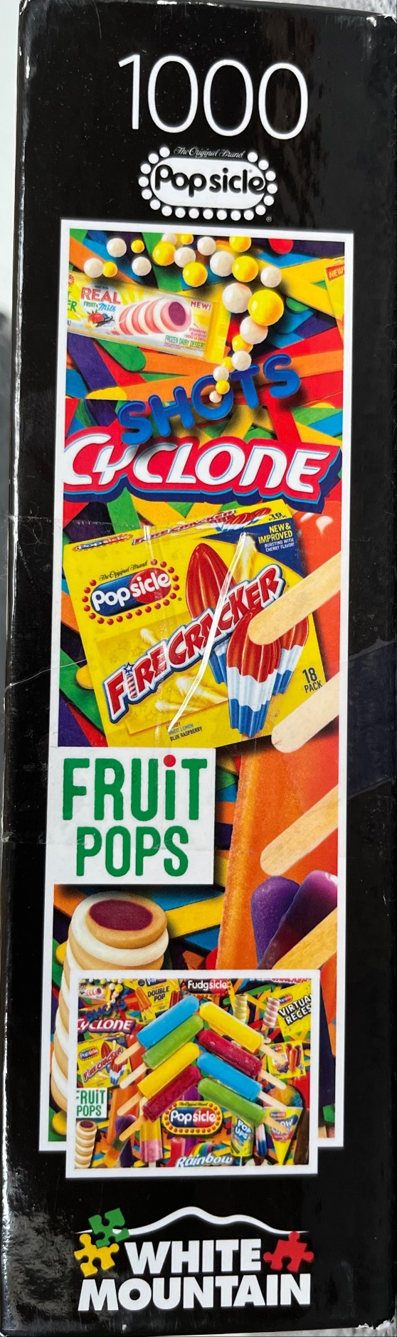 A collage of various colorful frozen treat wrappers and ice pops scattered across a background of wooden craft sticks.