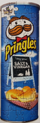 A tall, cylindrical Pringles potato chip can featuring Salt & Vinegar flavour branding.