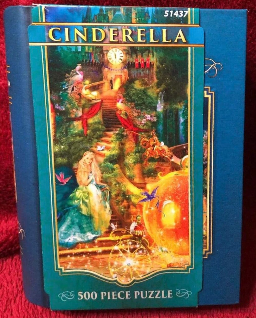 An illustration of Cinderella sitting near a glowing pumpkin carriage by a stone staircase leading to a clock tower.