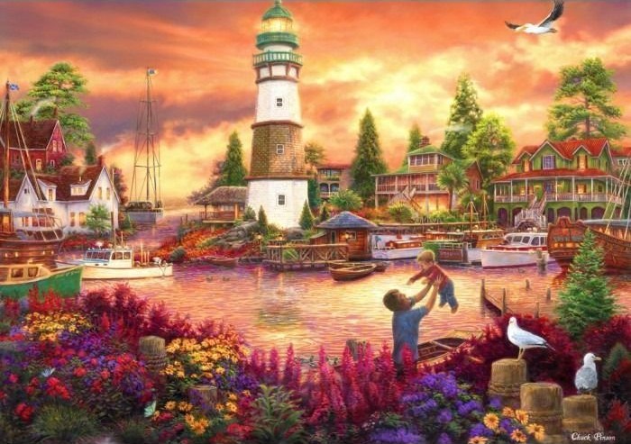 A father lifts his toddler by a coastal harbor during a sunset near a lighthouse.