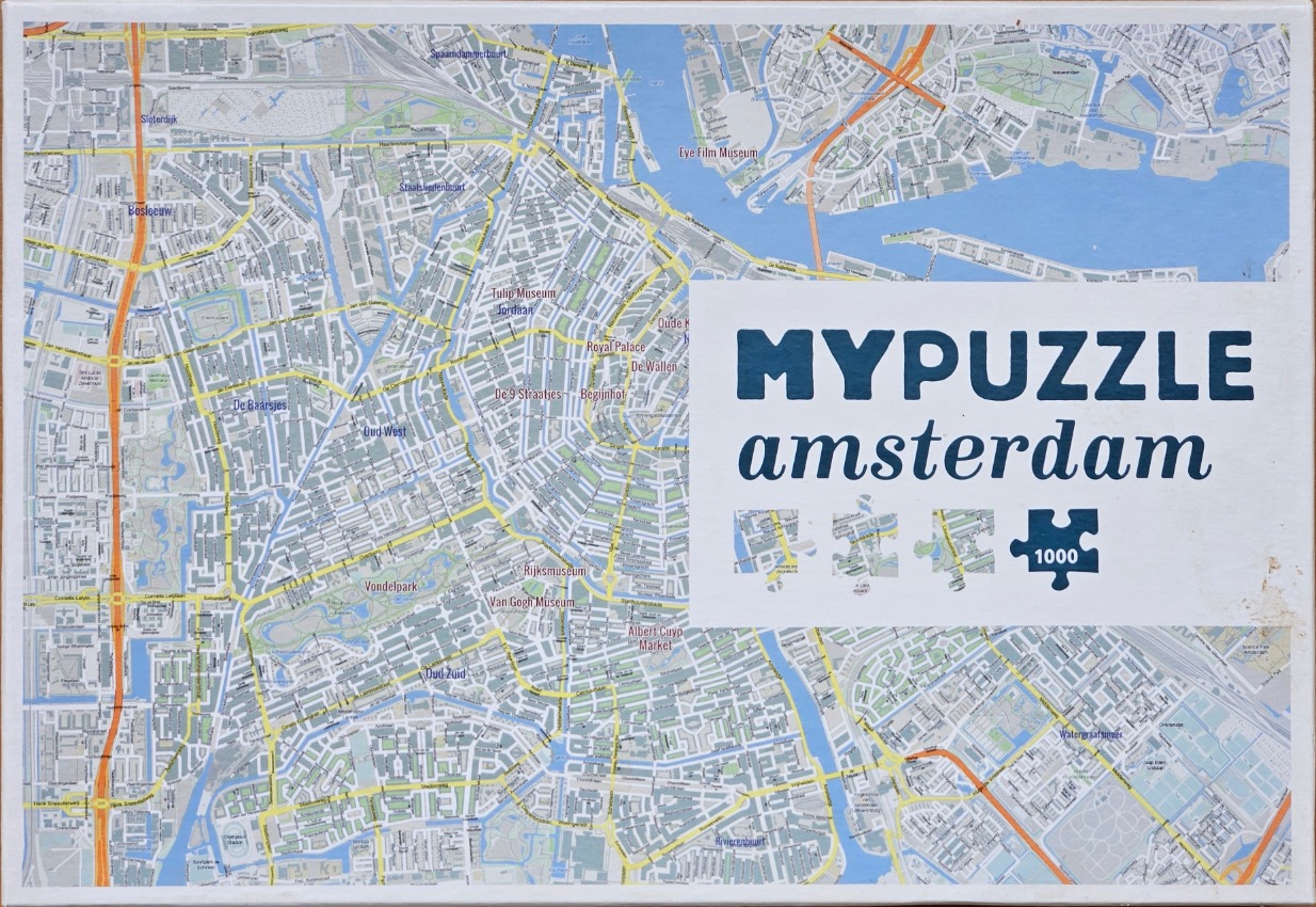 A detailed overhead map of Amsterdam, Netherlands, featuring city streets, canals, and landmarks.