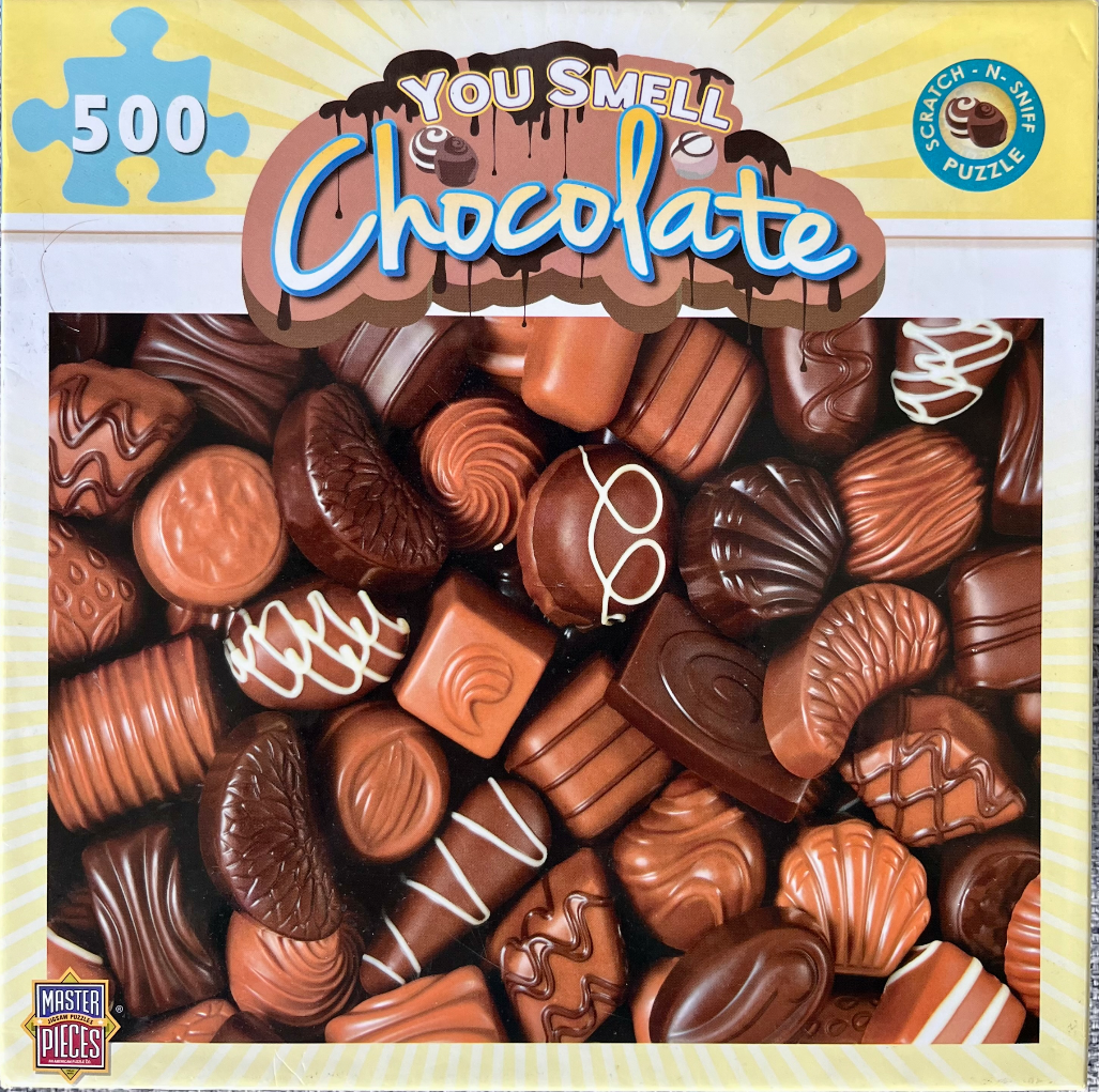 A close-up illustration of an assortment of various chocolate candies, including truffles, creams, and pralines.