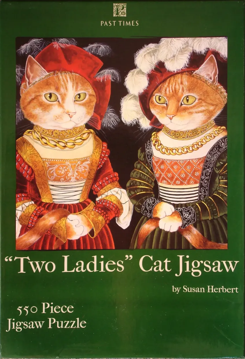 Two ginger tabby cats dressed in ornate Renaissance-era clothing and hats.