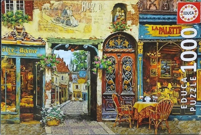 Oil painting style street scene featuring a French bakery, a bistro named La Palette, and a cobblestone archway.