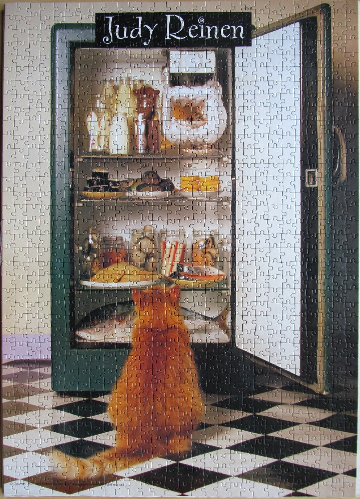 A fluffy orange cat sits on a black and white checkered floor, gazing into an open refrigerator full of food.