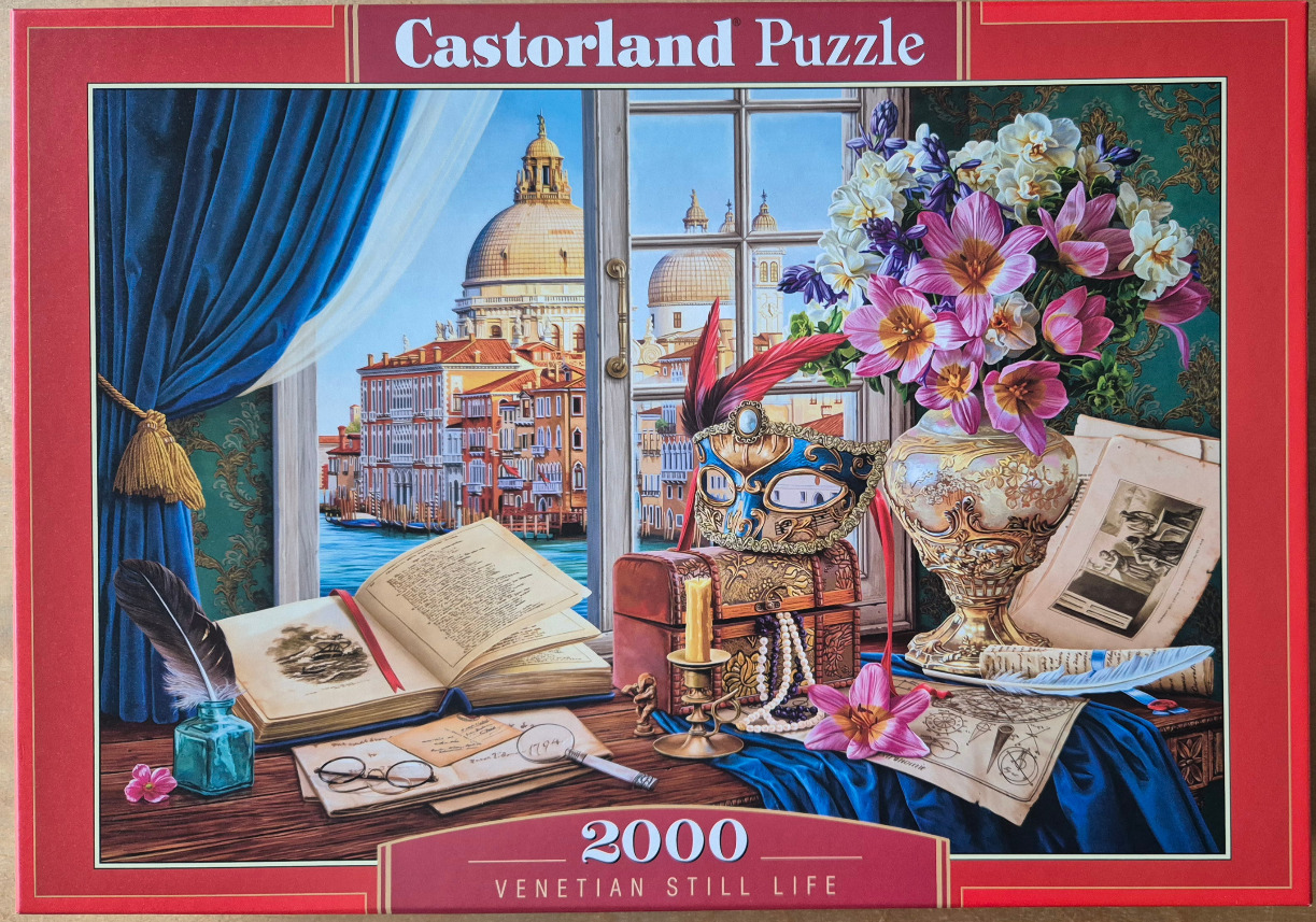 Venetian scene through a window with a masquerade mask, flowers, and old books on a wooden desk