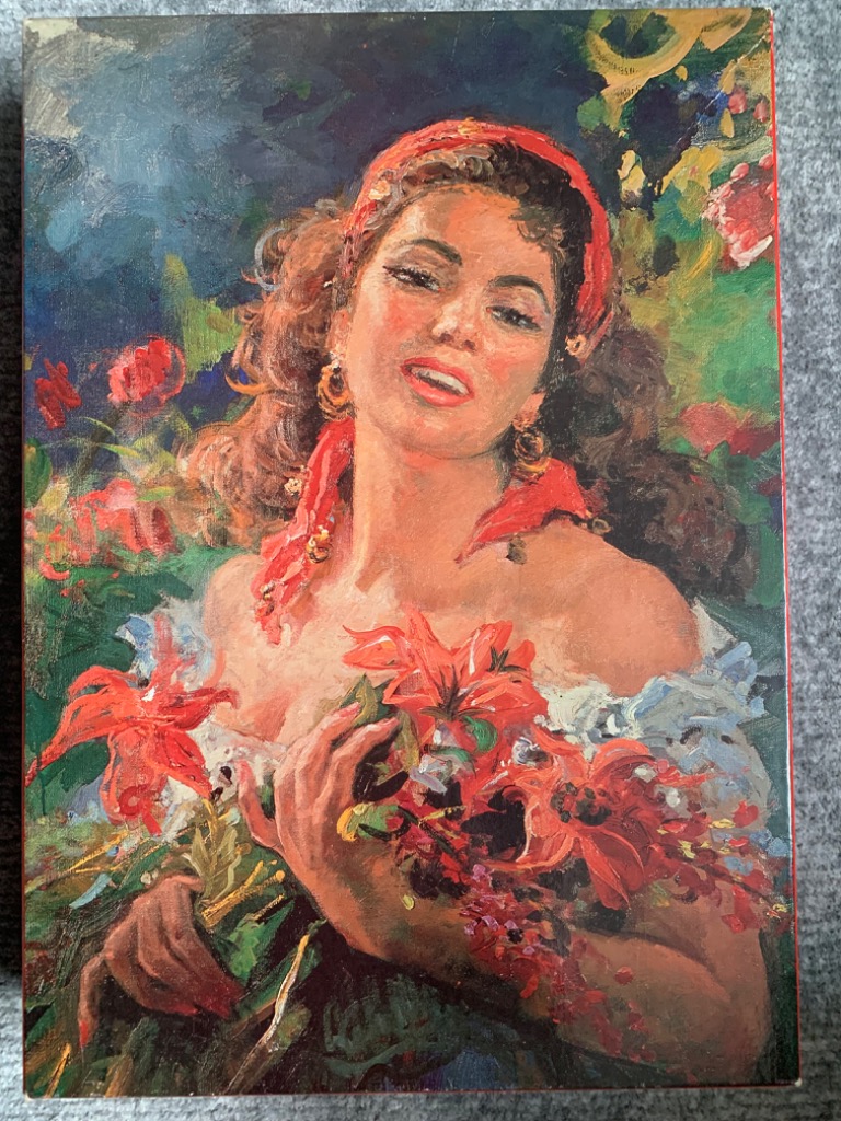 Oil painting of a smiling woman with dark hair and a red headband, holding a bouquet of red flowers.