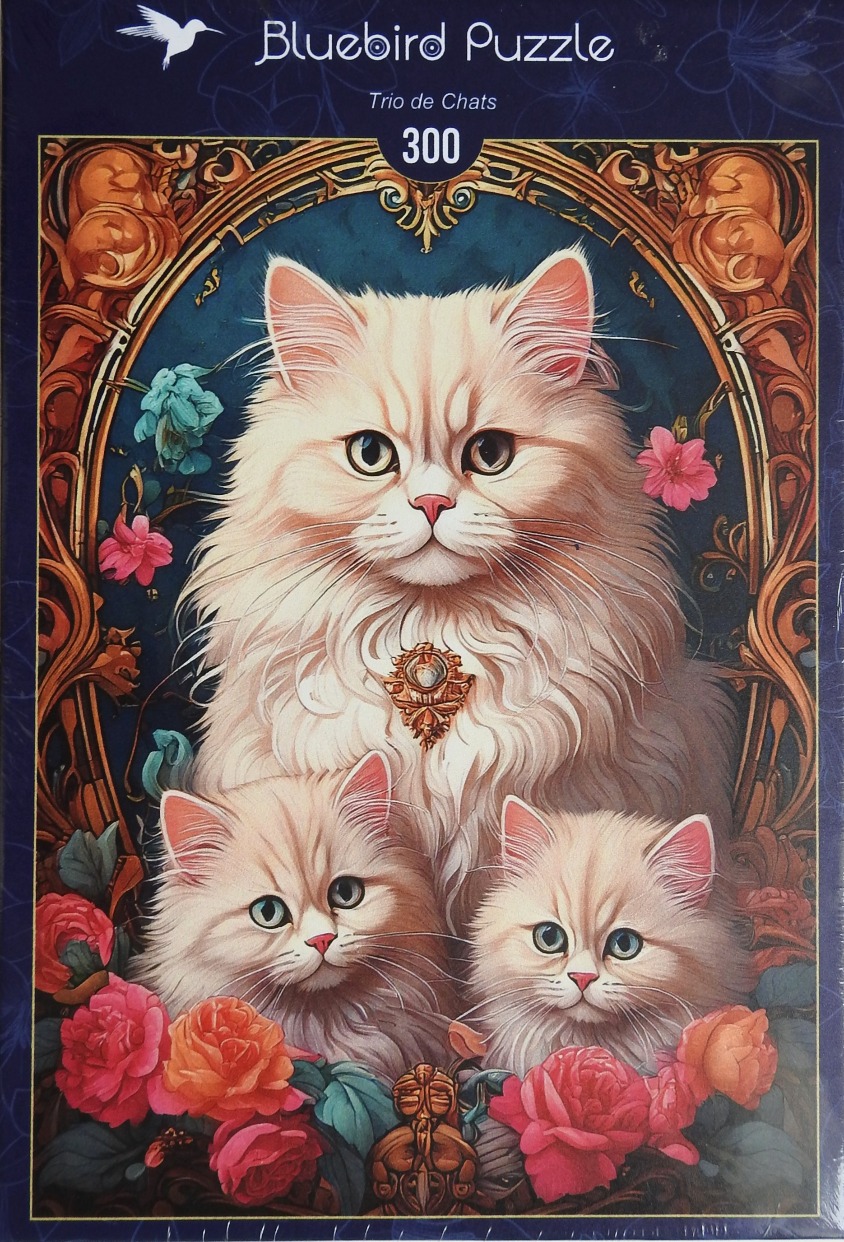 A regal long-haired cat and two kittens surrounded by roses inside an ornate oval frame.