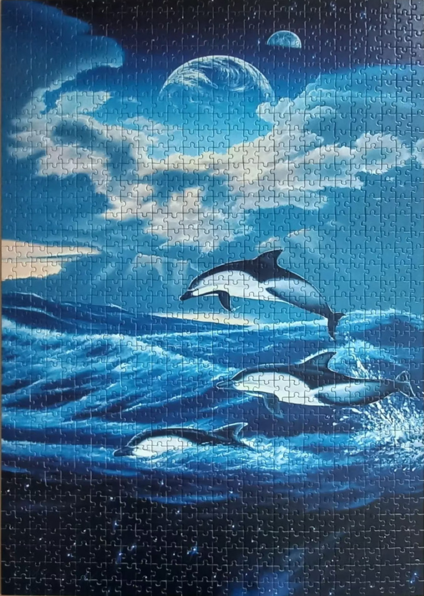 Three dolphins leaping over dark blue ocean waves beneath a cosmic sky with two planets and large clouds.