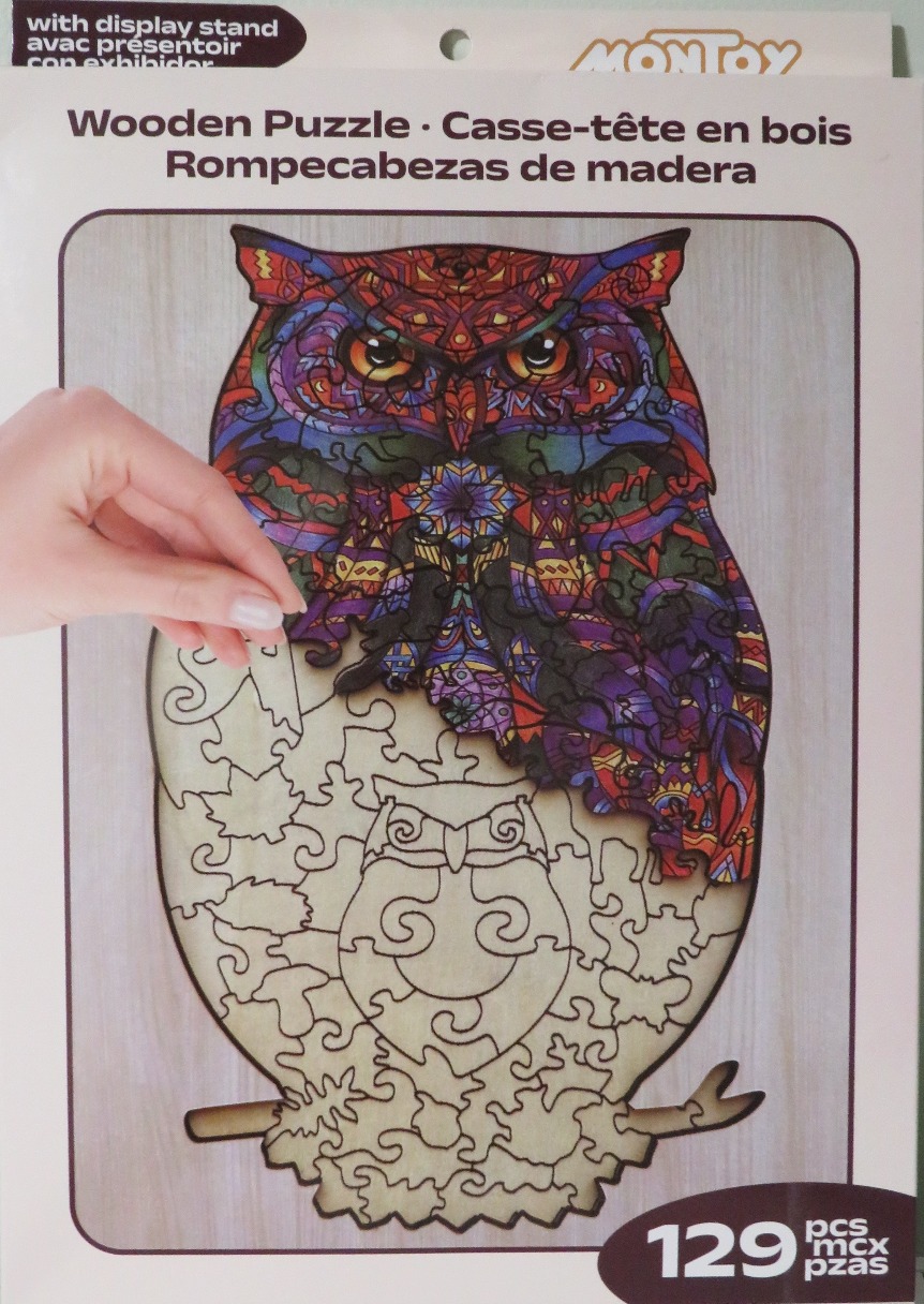 Ornately patterned owl illustration featuring colorful, intricate geometric and mandala-style designs.