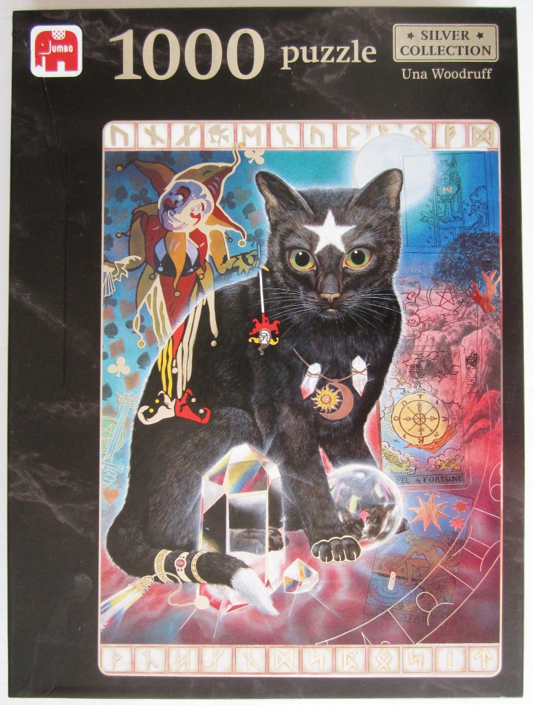 A black cat with a white star on its forehead sits surrounded by mystical and tarot imagery.